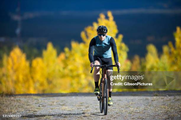 gravel road bicycle ride - men's cycling stock pictures, royalty-free photos & images