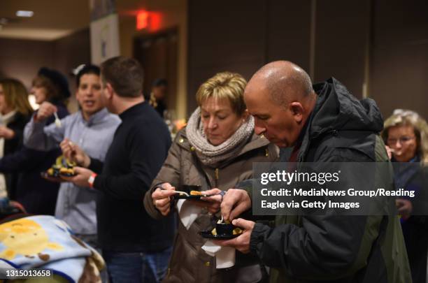 Cindy and Jack Ciarlone of Fleetwood taste test some chili on Saturday at the Chili Cook-Off at the DoubleTree by Hilton during the 2017 Fire + Ice...