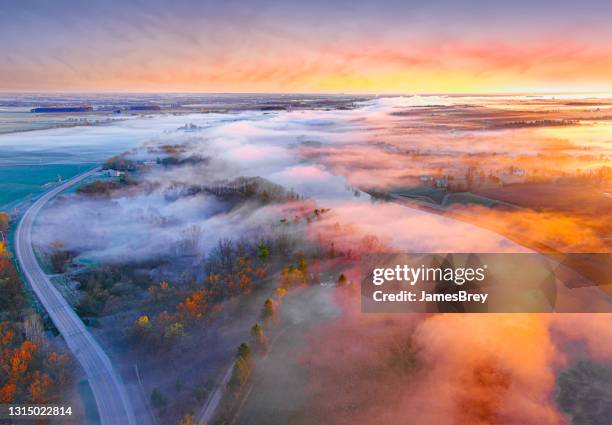 astonishing beauty at dawn, as warn river water makes fog - great river road stock pictures, royalty-free photos & images