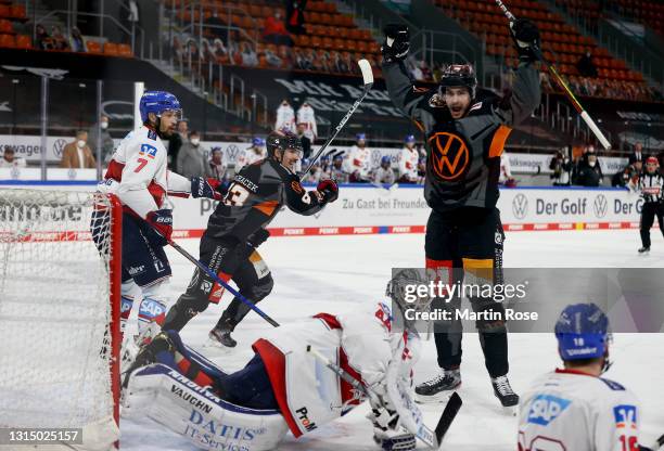 Matti Järvinen of Grizzlys Wolfsburg celebrates his team's equalizing goal during the Penny DEL Playoff Semi Final Game 2 between Grizzlys Wolfsburg...