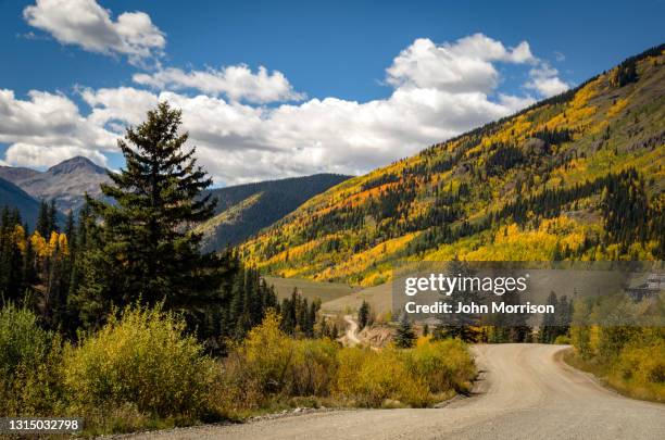 autumn color on southwestern colorado dirt backroad - ouray colorado stock pictures, royalty-free photos & images