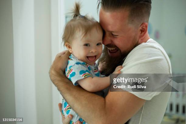 day in the life of father - down syndrome baby stock pictures, royalty-free photos & images
