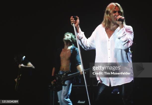 Rick Savage, Phil Collen, and Joe Elliott of Def Leppard perform at Shoreline Amphitheatre on August 31, 1996 in Mountain View, California.