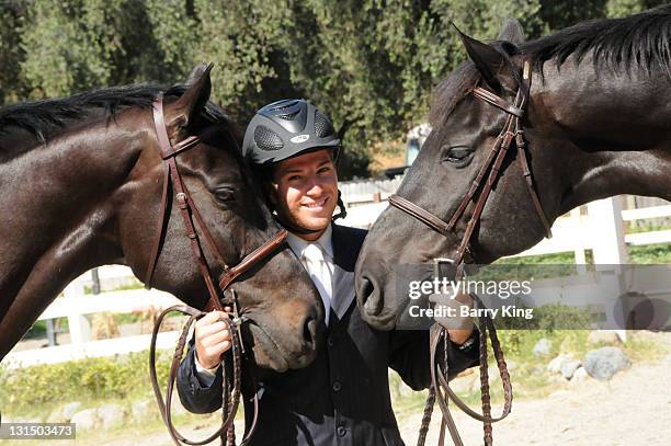 Elite Equestrian Rider Nick Haness poses with horses Ned and Southern during a photo shoot on July 5, 2010 in Silverado, California.