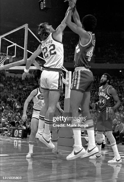 Golden State Warriors forward Jamaal Wilkes shoots a jumper over Denver Nuggets forward Gus Gerard during an NBA basketball game at McNichols Arena...