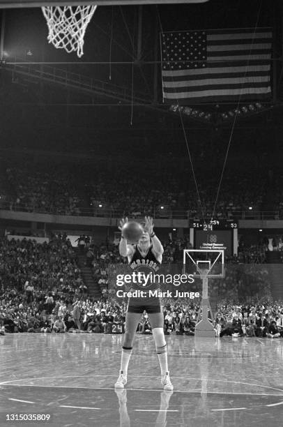Golden State Warriors forward Rick Barry shoots an unorthodox but effective, underhanded free throw in a game during an NBA basketball game against...