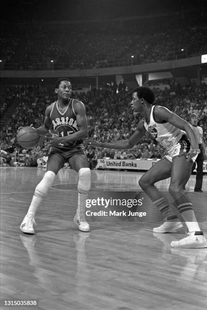 Denver Nuggets forward David Thompson checks Golden State Warriors guard Charles Dudley during an NBA basketball game at McNichols Arena on November...