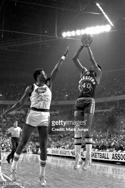 Golden State Warriors forward Derrick Dickey takes a jumper near the key while Denver Nuggets forward Paul Silas attempts to block the shot during an...