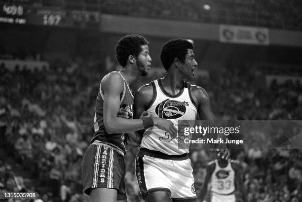 Golden State Warriors forward Jamaal Wilkes guards Denver Nuggets forward Paul Silas during an NBA basketball game at McNichols Arena on November 9,...