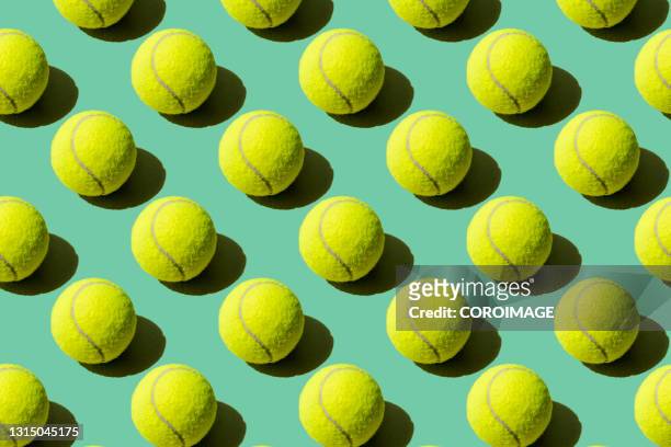 paddle tennis balls on a green background - pilota stock-fotos und bilder