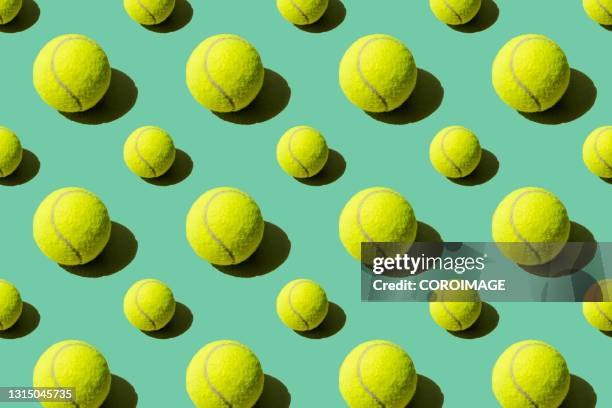 paddle tennis balls on a green background - tennis foto e immagini stock