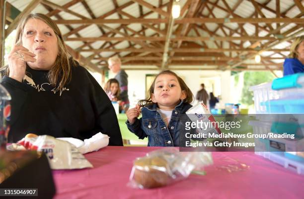 Mel Kaucher of Birdsboro and Lenox Ramirez of Sinking Spring have snacks together during the 2018 Love for Lexi Foundation Fundraiser Saturday at...
