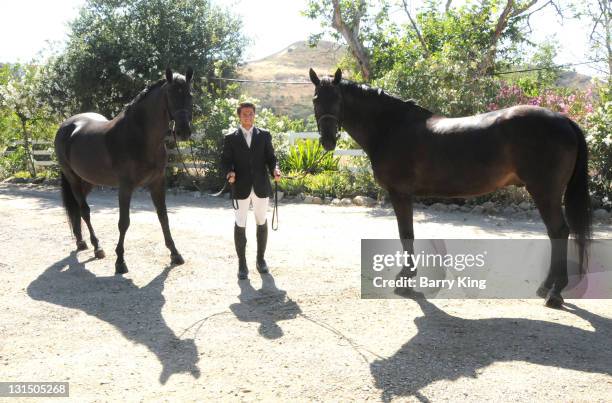 Elite Equestrian Rider Nick Haness poses with horses Ned and Southern during a photo shoot on July 5, 2010 in Silverado, California.