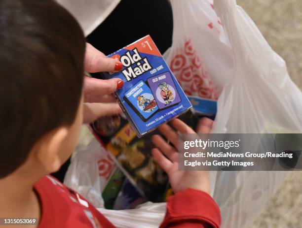 Ryan Foo looks at some of the games for the children in the pediatric unit. At the Reading Hospital Thursday afternoon where Jen Foo and her son Ryan...