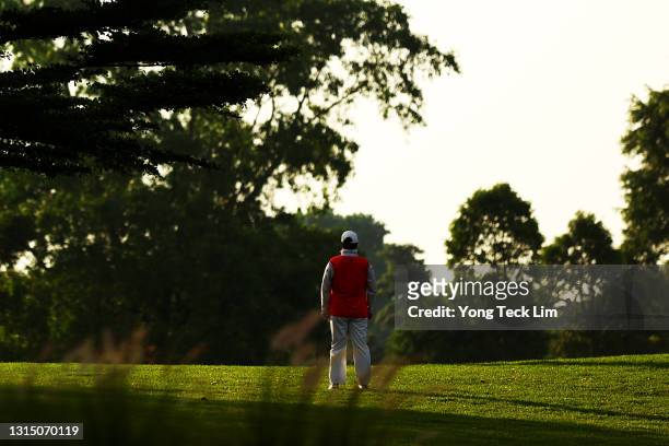 Shanshan Feng of China looks on after putting on the 10th green during the first round of the HSBC Women's World Championship at Sentosa Golf Club on...