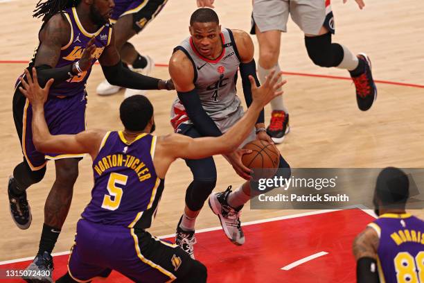 Russell Westbrook of the Washington Wizards looks to pass in front of Talen Horton-Tucker of the Los Angeles Lakers during the first half at Capital...