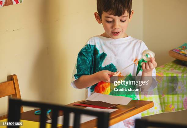 Boy Using Paper 592 Boy Cutting Paper Stock Photos, High-Res Pictures, and Images ...