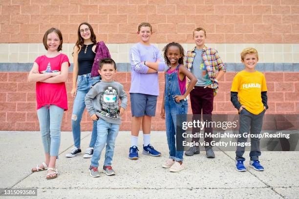 From left; Alise Nierle, Sabrina Avanzato, Dexton McKim, Brady Snyder, Beza Politzer, Alex Snyder and Conley McKim pose for a photograph in clothes...