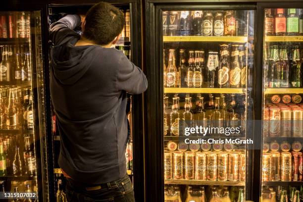 An employee stocks alcohol at a shop on April 28, 2021 in Istanbul, Turkey. The Turkish government announced a new full three week lockdown between...