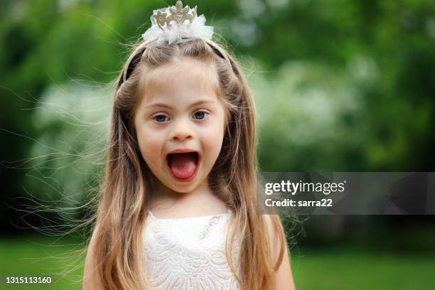 girl with down syndrome dressed up like a princess - kids tiara stock pictures, royalty-free photos & images