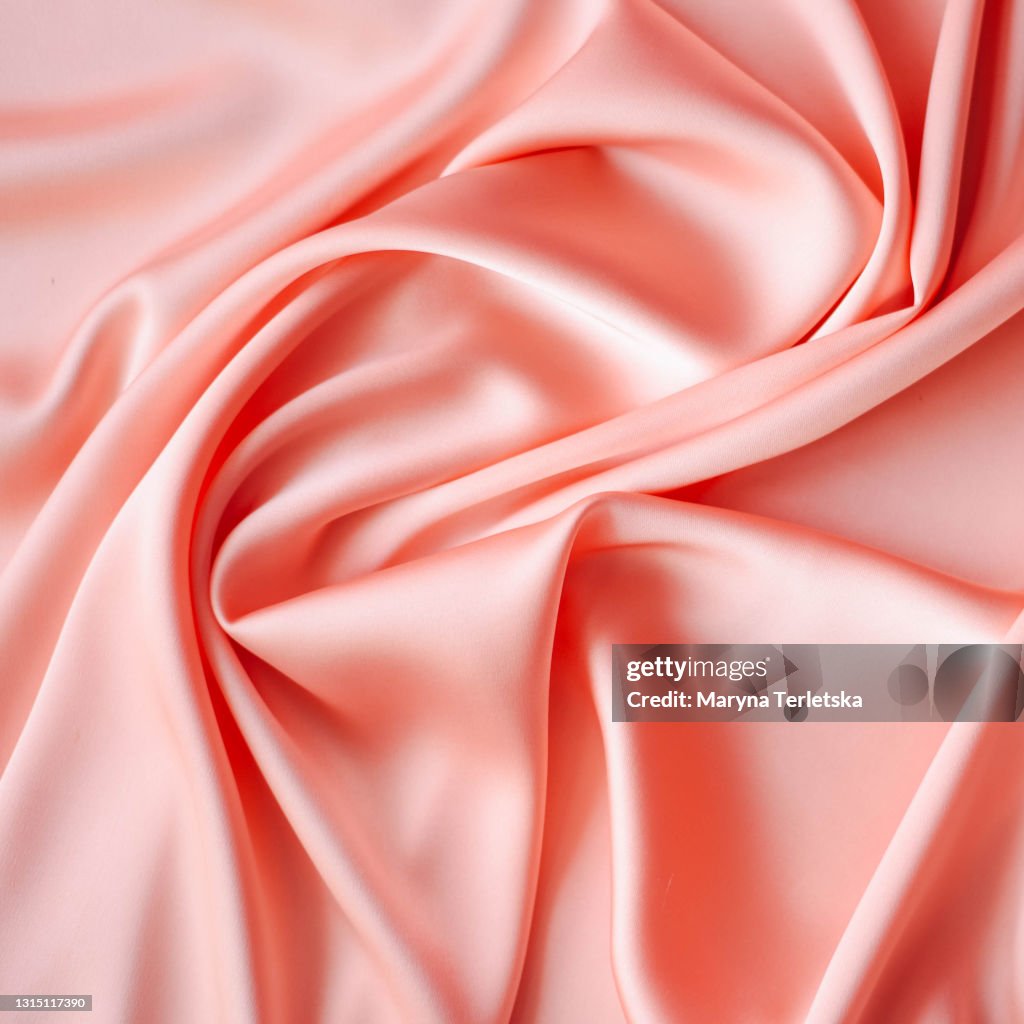 Background From Satin Fabric Of Peach Color High-Res Stock Photo - Getty  Images