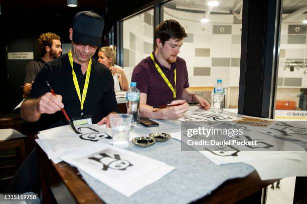 Athletes and staff learn Chinese Calligraphy during a media opportunity during the Processing Session for the Australian Olympic team ahead of the...