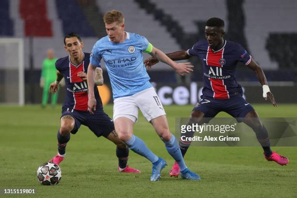 Kevin de Bruyne of Manchester City is challenged by Angel di Maria and Idrissa Gueye of Paris Saint-Germain during the UEFA Champions League Semi...