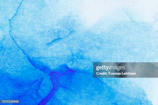 macro close-up of blue alcohol ink layers and splashes, abstract background. - light blue textured background stock pictures, royalty-free photos & images