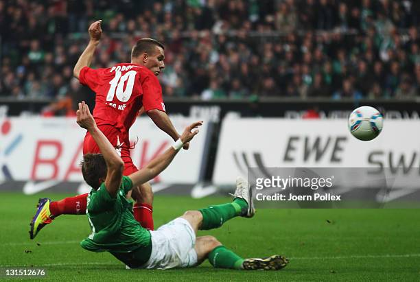 Lukas Podolski of Koeln scores his team's second goal during the Bundesliga match between Werder Bremen and 1. FC Koeln at Weser Stadium on November...