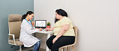 Dietitian consultation. Woman visits nutritionist for treatment obesity