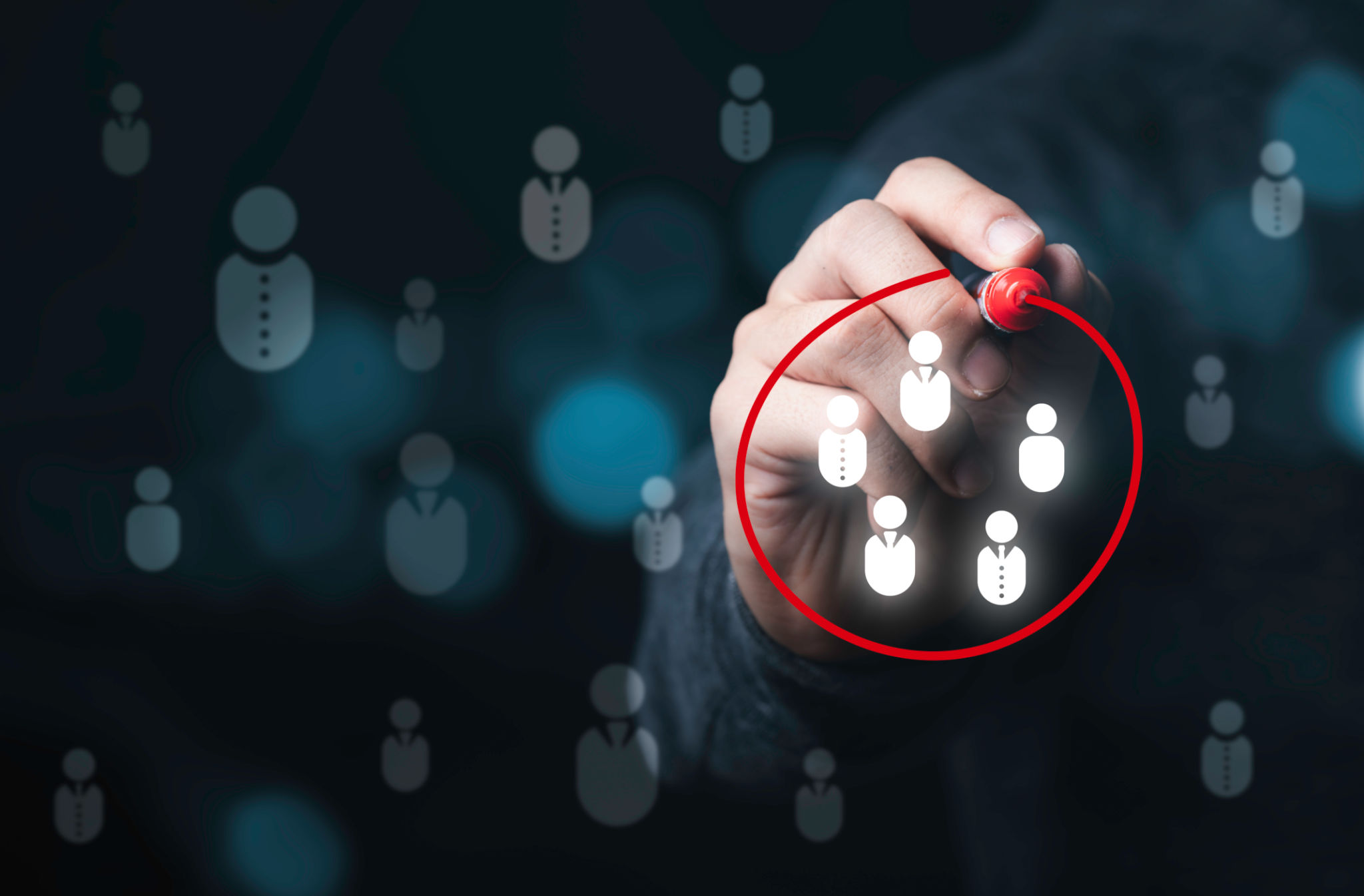 Businessman drawing red circle to marking and select human icons , Human development or marketing focus customer target group. Businessman drawing red circle to marking and select human icons , Human development or marketing focus customer target group.