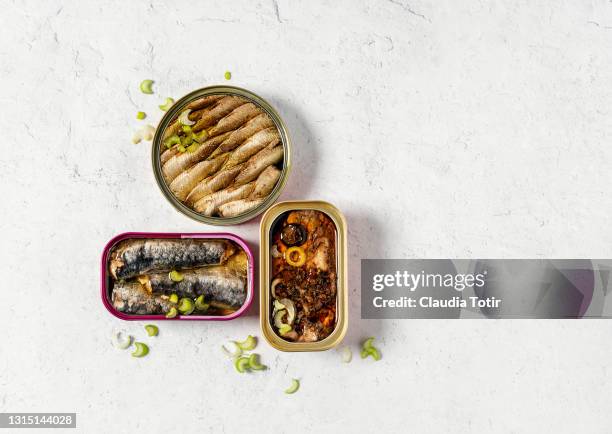 canned sardines on white background - preserved food stock pictures, royalty-free photos & images