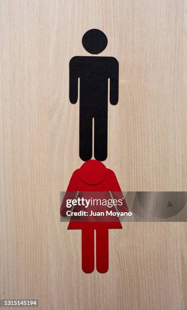 man on top of a woman - wage gap stock pictures, royalty-free photos & images