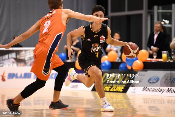 Francis Mulvihill of the Mountainairs dribbles the ball up the court during the round one NBL match between the Southland Sharks and the Taranaki...