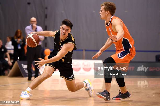 Francis Mulvihill of the Mountainairs dribbles the ball up the court during the round one NBL match between the Southland Sharks and the Taranaki...
