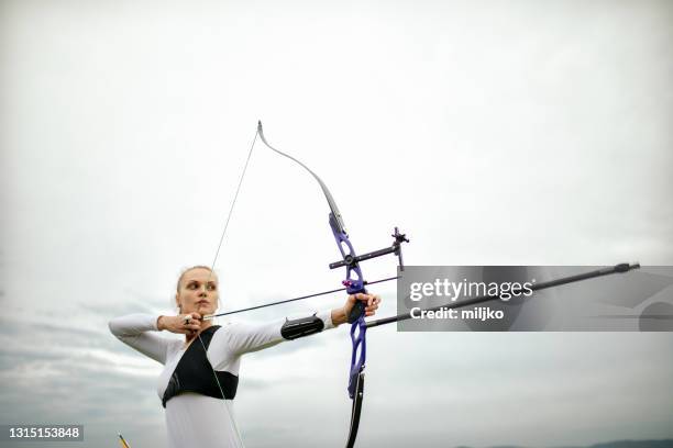 archery training on open field - archery stock pictures, royalty-free photos & images