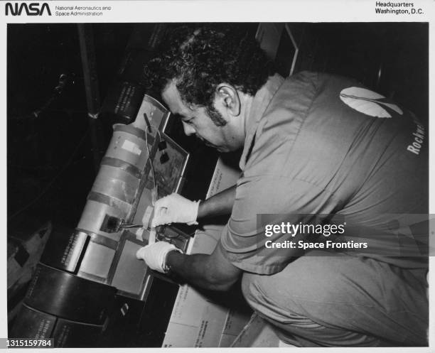 Rockwell International technician prepares a cavity on the Space Shuttle Orbiter Columbia's vertical stabilizer for bonding of an instrumented tile,...