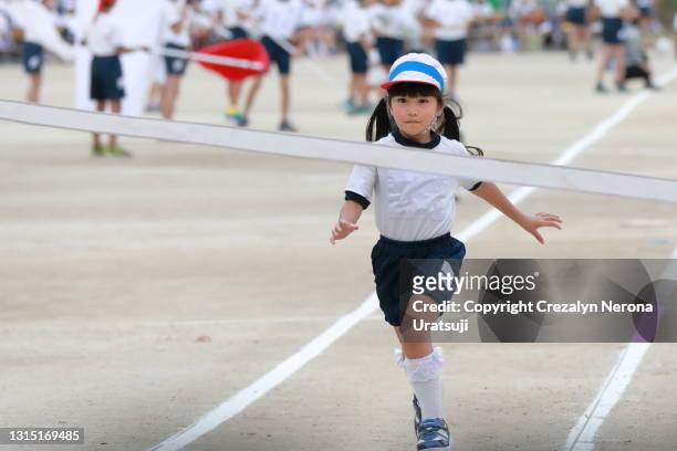 japan elementary sports day portrait student running - japan racing stock-fotos und bilder