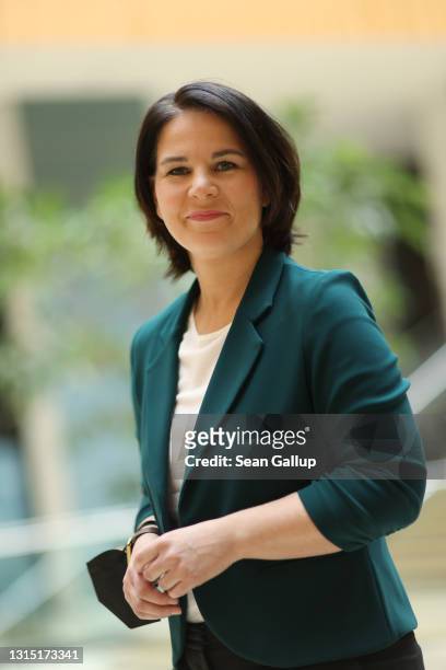 Annalena Baerbock, chancellor candidate and co-leader of the German Greens Party, prepares to depart after she spoke to the media following Germany's...