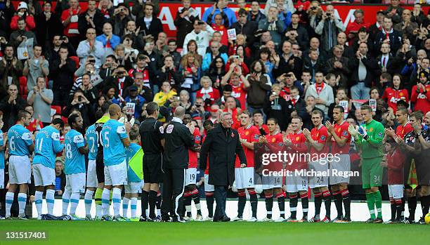 Sir Alex Ferguson walks out to a guard of honour to after 25 years as Manchester United manager is displayed outside the ground before the Barclays...