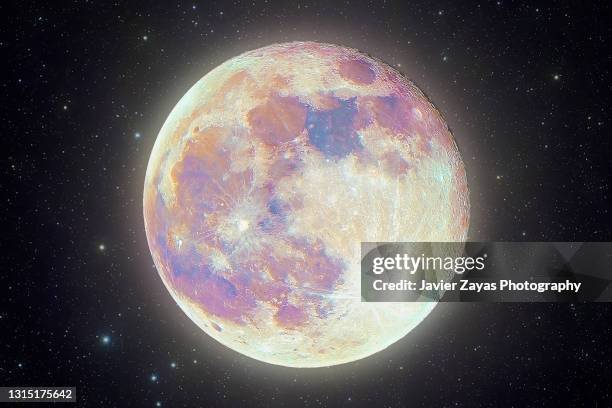 full moon "supermoon" pink moon against stars background - planetary moon stock pictures, royalty-free photos & images