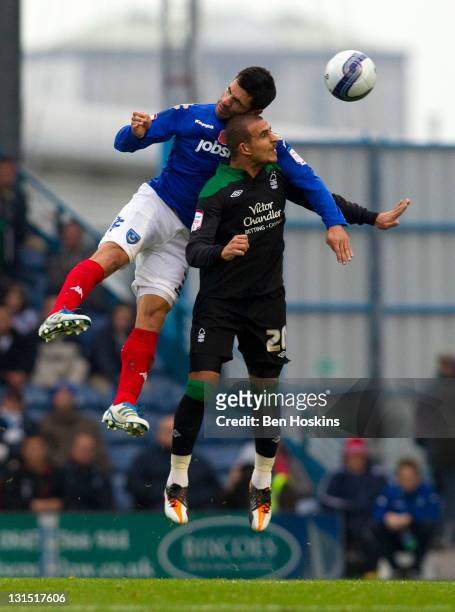 Marcus Tudgay of Nottingham Forest battles with Ricardo Rocha of Portsmouth in the air during the npower Championship match between Portsmouth and...