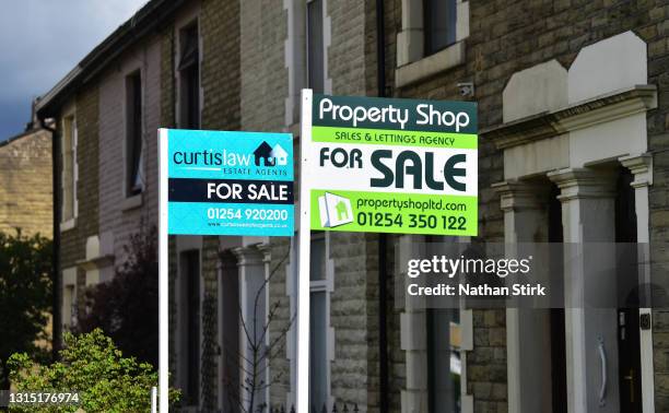 Placards from various housing estates agents advertising properties for sale on April 29, 2021 in Blackburn, England.