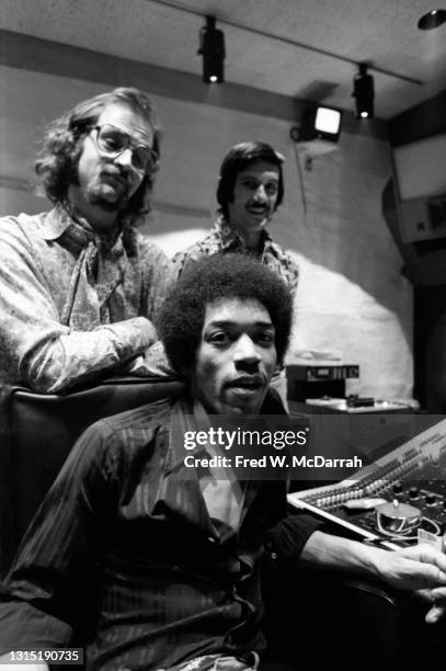 Portrait of American musician Jimi Hendrix , South African-born American music producer and engineer Eddie Kramer and studio manager Jim Marron as...