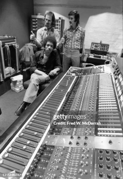 Portrait of American musician Jimi Hendrix , South African-born American music producer and engineer Eddie Kramer and studio manager Jim Marron as...