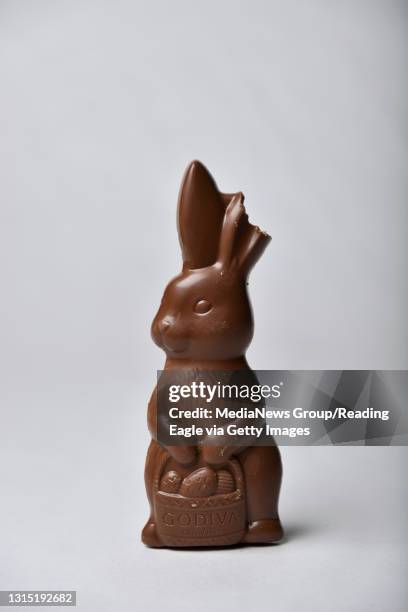 Godiva chocolate candy Easter Bunny with a bite taken out of one ear, photographed on a white background in the studio Friday evening March 3, 2016...