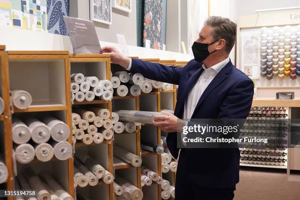 Labour Party leader Sir Keir Starmer browses through the wallpaper section at John Lewis & Partners department store at the Intu Trafford Centre on...