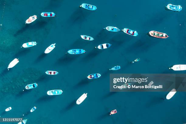 overhead view of moored boats in a harbor - förtöjd bildbanksfoton och bilder