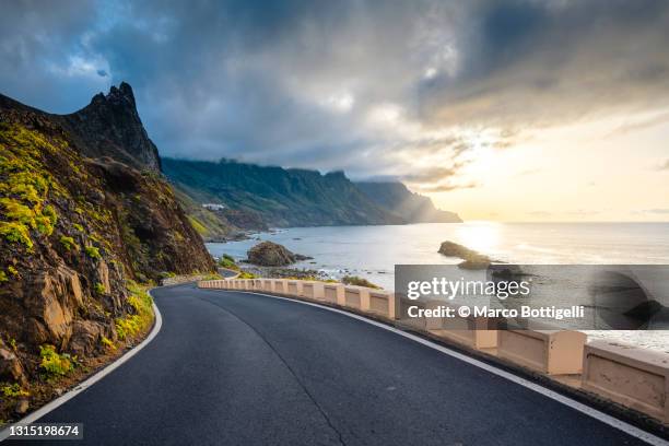 scenic coastal road at sunset - street curve bildbanksfoton och bilder