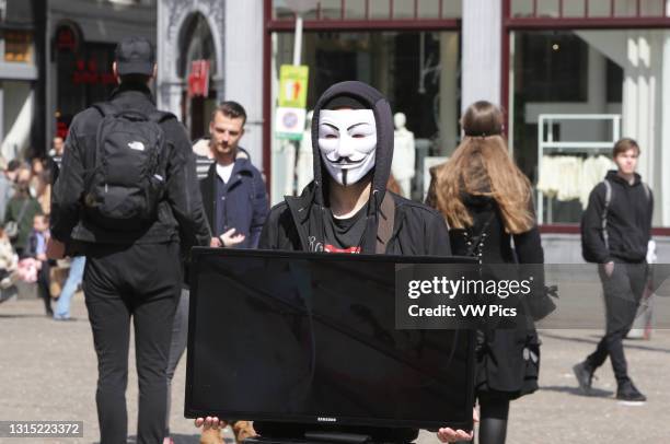 Anonymous for the Voiceless animal rights organisation activists take part during Cube of Truth protest in front of the Royal Palace at the Dam...